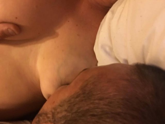 Woman breast feeds her boyfriend.
