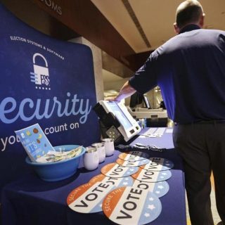 An Election Systems & Software employee demonstrated security equipment at a National Association of Secretaries of States convention in Philadelphia in July.