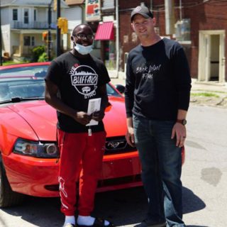 Antonio Gwynn Jr. (left) received a 2004 Mustang from Matt Block as a reward for Gwynn’s work cleaning up after protests